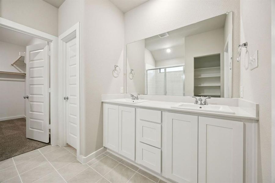 Primary Bathroom in the Oscar home plan by Trophy Signature Homes – REPRESENTATIVE PHOTO