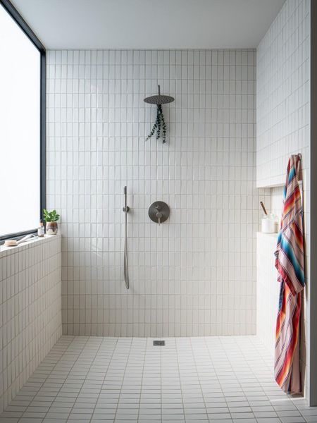Full bathroom with a tile shower
