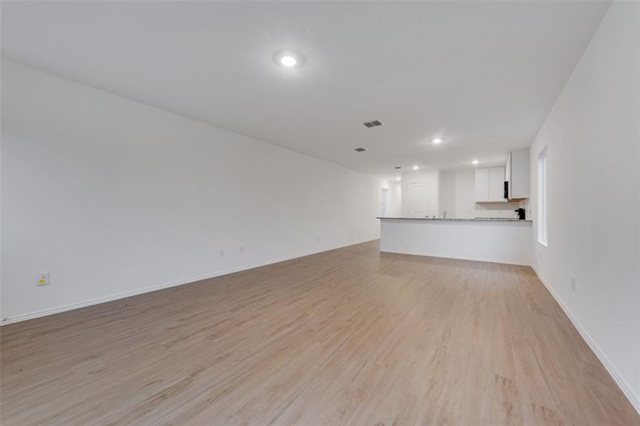 Unfurnished living room with light hardwood / wood-style flooring