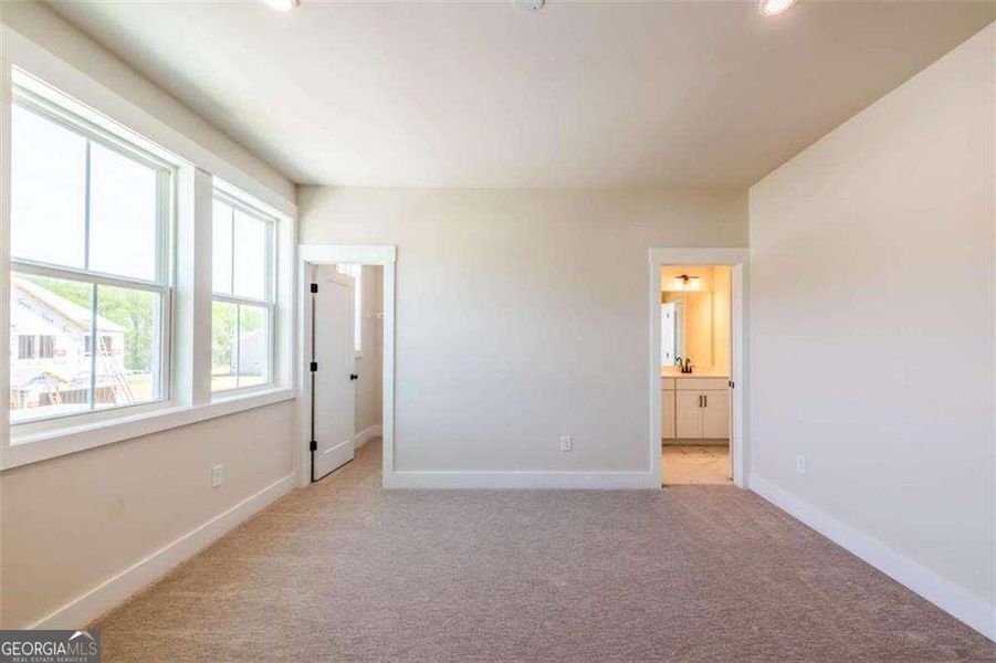 Spacious, unfurnished interior of a new home in The Paddocks at Doc Hughes, Buford (Image 31).