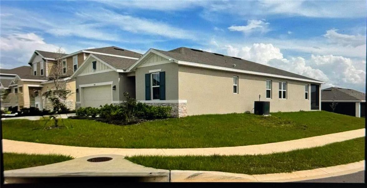 Front exterior of a new home in , Haines City, FL, highlighting curb appeal (Image 2). Front exterior of a new home in , Haines City, FL, highlighting curb appeal (Image 2).
