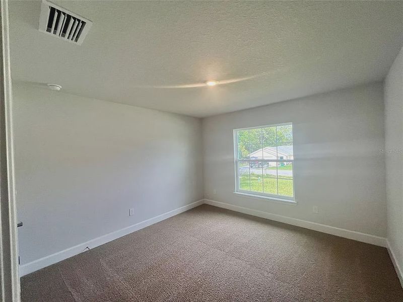 Spacious, unfurnished interior of a new home in Orange Blossom Hills, Summerfield (Image 9).