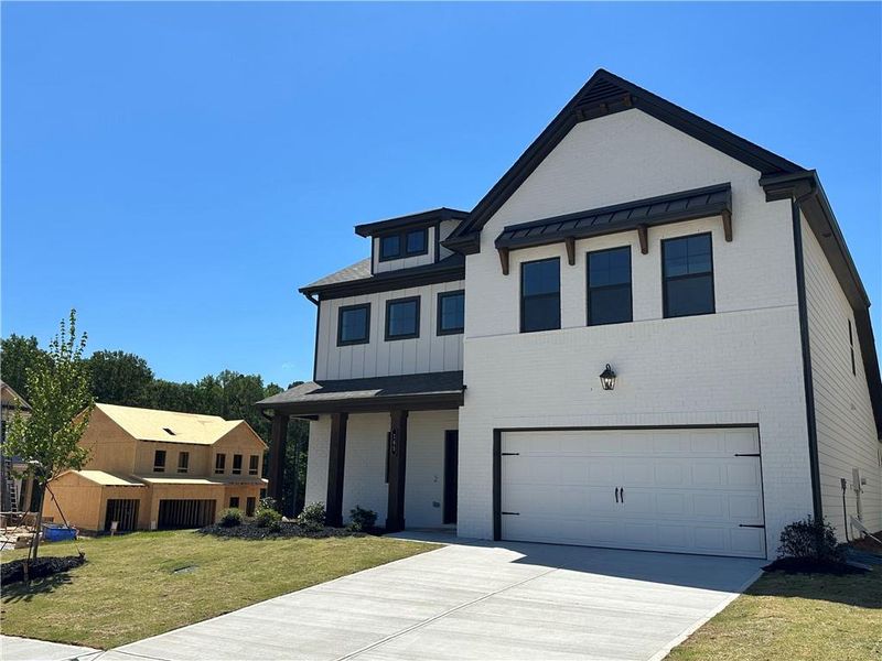 Front exterior of a new home in Summerlin, Winder, GA, highlighting curb appeal (Image 29).
