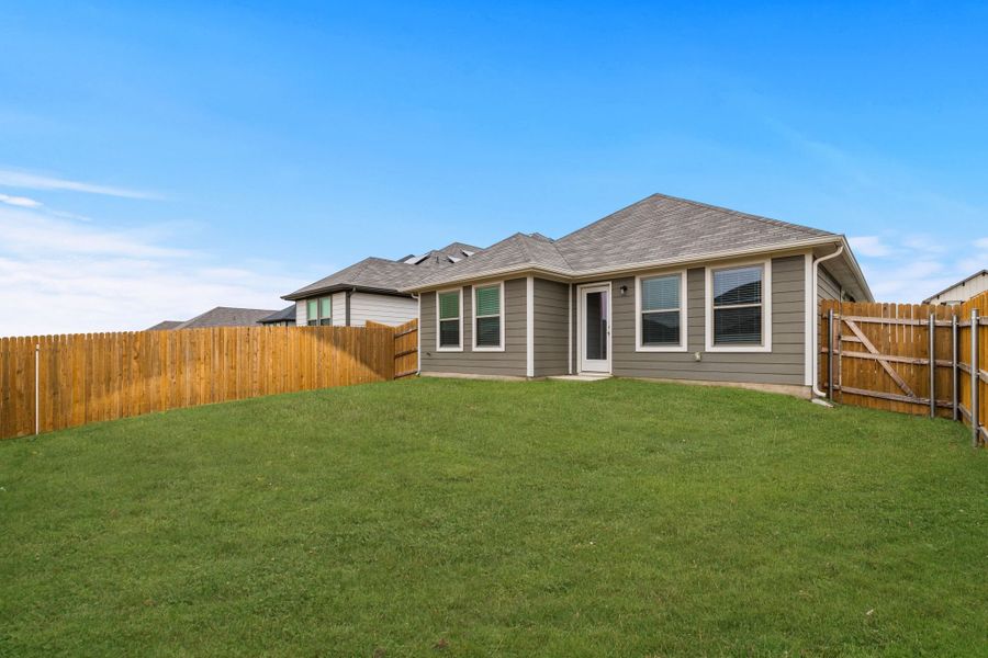 Exterior details and patio area of a home in Trinity Ranch, Elgin (Image 24).