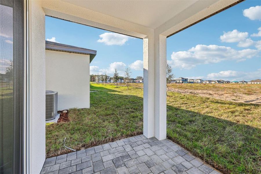 Exterior details and patio area of a home in Wynnstone - Signature Series, Davenport (Image 4).