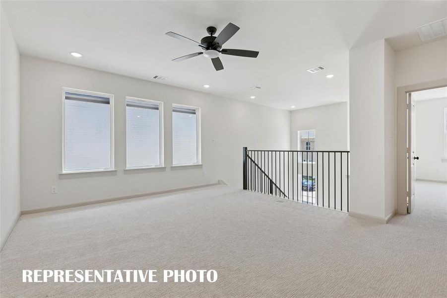 The spacious game room in our Bella plan provides the perfect place to host those big game day parties or family game night!  REPRESENTATIVE PHOTO