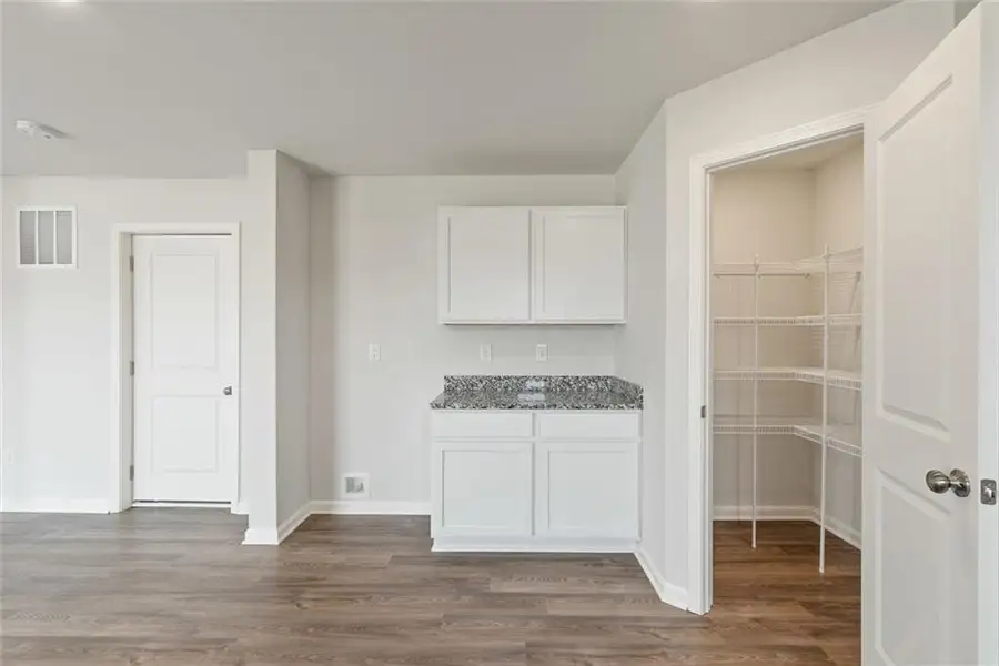 Furnished interior view inside a new home in Liberty Pointe, Villa Rica (Image 5).