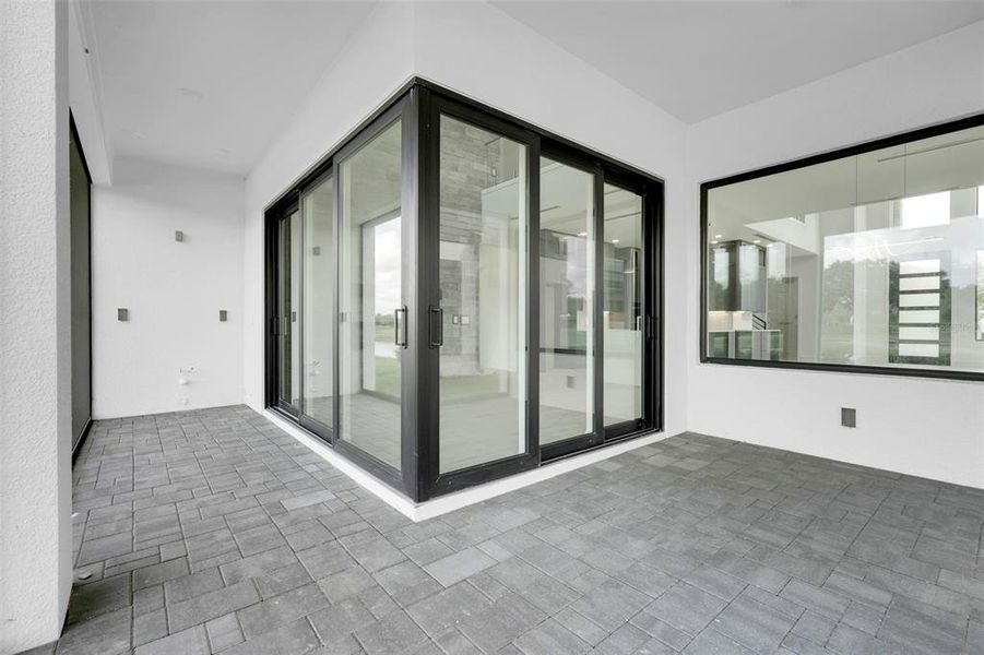 Exterior details and patio area of a home in Hampton Green at Providence, Davenport (Image 34).