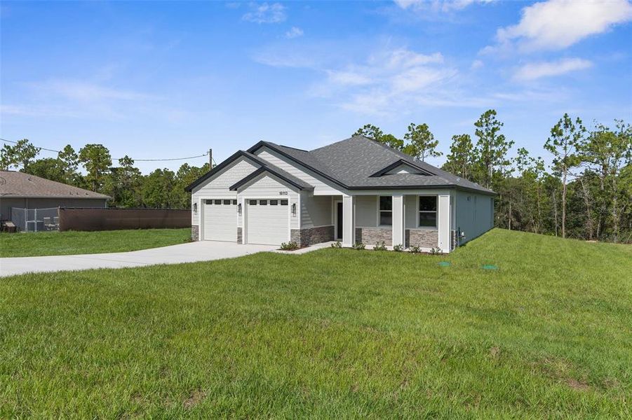 Front exterior of a new home in , Weeki Wachee, FL, highlighting curb appeal (Image 29).