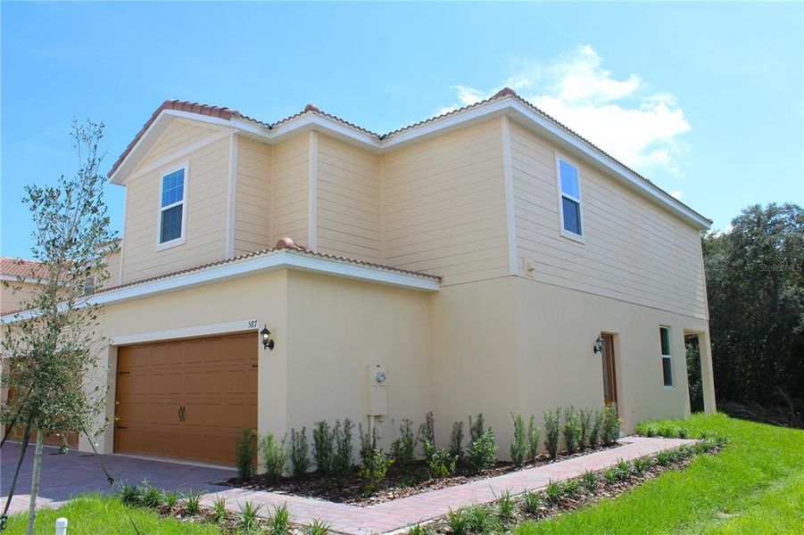 Exterior details and patio area of a home in Noah Estates at Tuscany Preserve, Poinciana (Image 2).