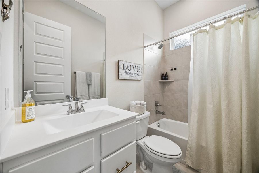 A conveniently located full bathroom on the first floor sits just next to the flex room, making it ideal for guests or multigenerational living.