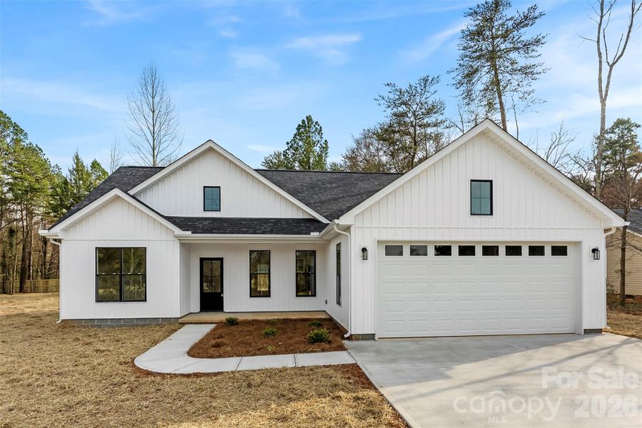 Front exterior of a new home in , China Grove, NC, highlighting curb appeal (Image 20).