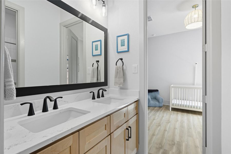 Double sinks in secondary bathroom 3. View from bedroom 3. Double sinks in secondary bathroom 3. View from bedroom 3.