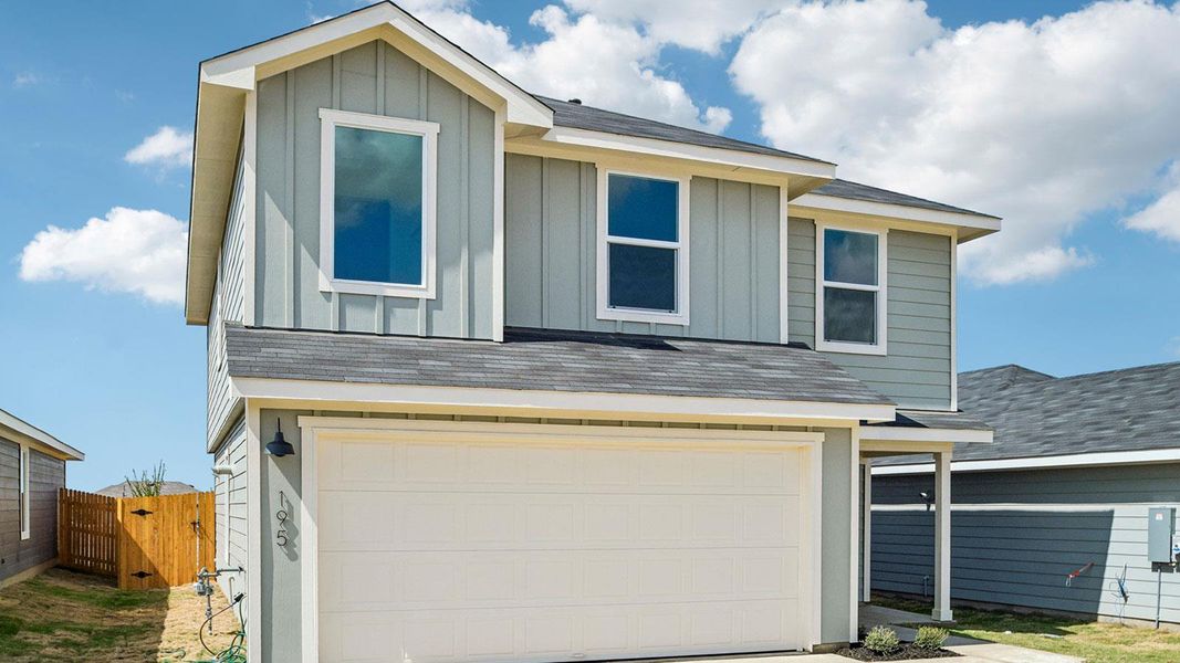 Front exterior of a new home in Prairie Lakes, Buda, TX, highlighting curb appeal (Image 18).