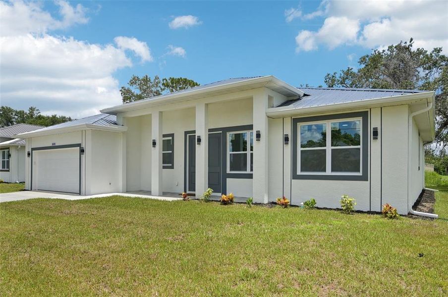 Front exterior of a new home in , North Port, FL, highlighting curb appeal (Image 20).