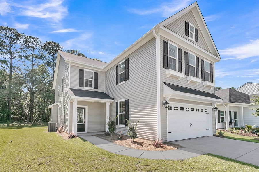 Front exterior of a new home in Six Oaks, Summerville, SC, highlighting curb appeal (Image 2). Front exterior of a new home in Six Oaks, Summerville, SC, highlighting curb appeal (Image 2).