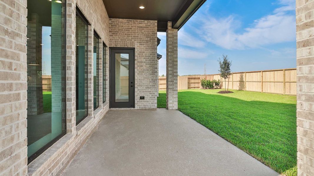 Exterior details and patio area of a home in Legacy Prairie at Katy Court, Katy (Image 3).