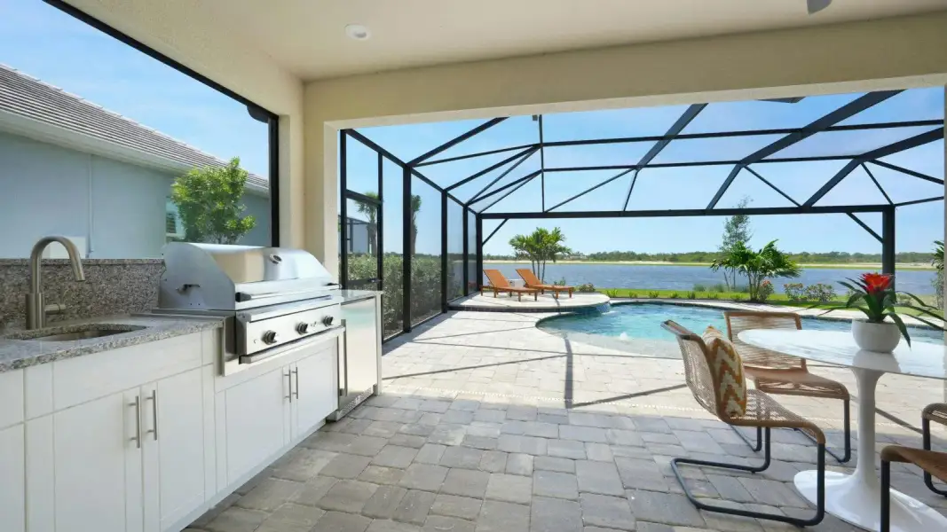 Exterior details and patio area of a home in Kingston South Real Estate and Homes for Sale in Estero, FL - Neal Communities, Estero (Image 4).