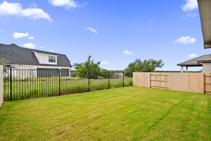 Exterior details and patio area of a home in Lariat, Liberty Hill (Image 26).