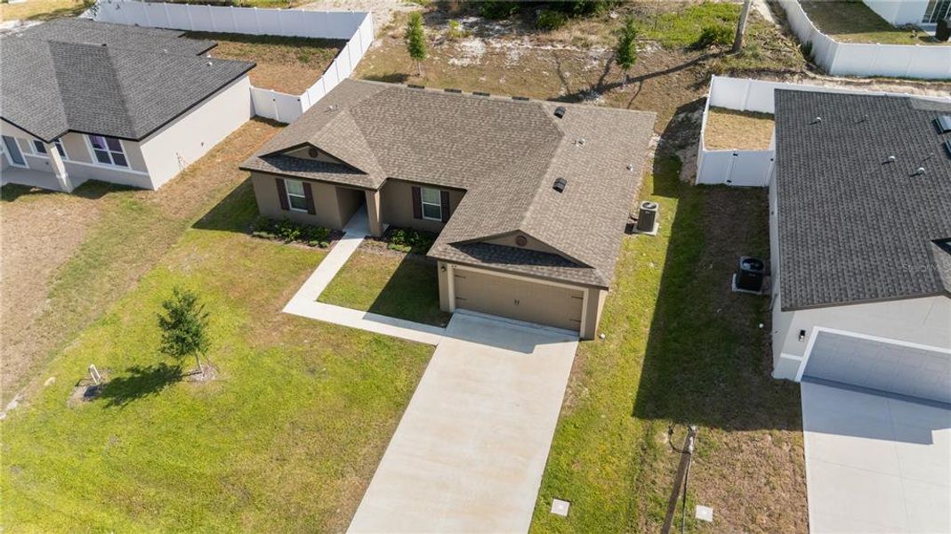 Front exterior of a new home in Poinciana, Poinciana, FL, highlighting curb appeal (Image 11).