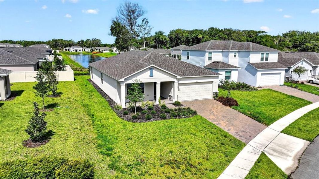 Front exterior of a new home in Riverfront, Edgewater, FL, highlighting curb appeal (Image 29). Front exterior of a new home in Riverfront, Edgewater, FL, highlighting curb appeal (Image 29).