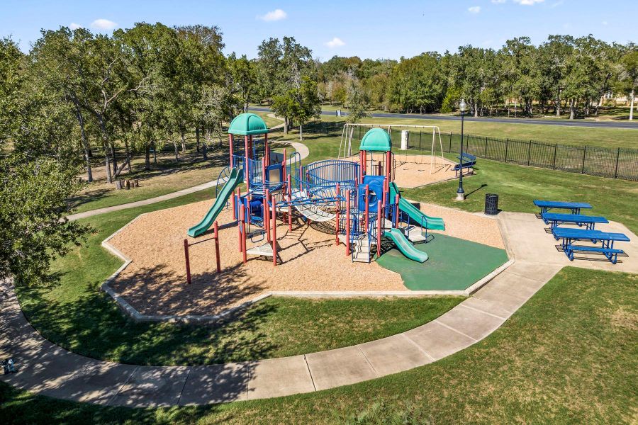 Beautiful park/playground with swings and picnic tables