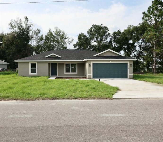 Front exterior of a new home in , Ocklawaha, FL, highlighting curb appeal (Image 2). Front exterior of a new home in , Ocklawaha, FL, highlighting curb appeal (Image 2).