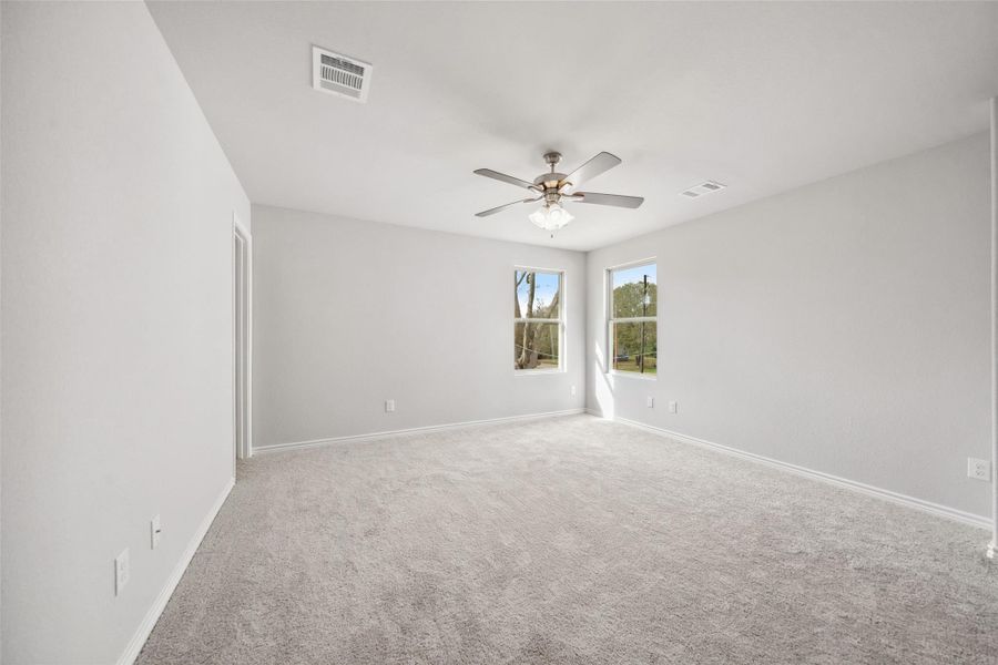 The primary suite boasts an abundance of space and plenty of natural light!