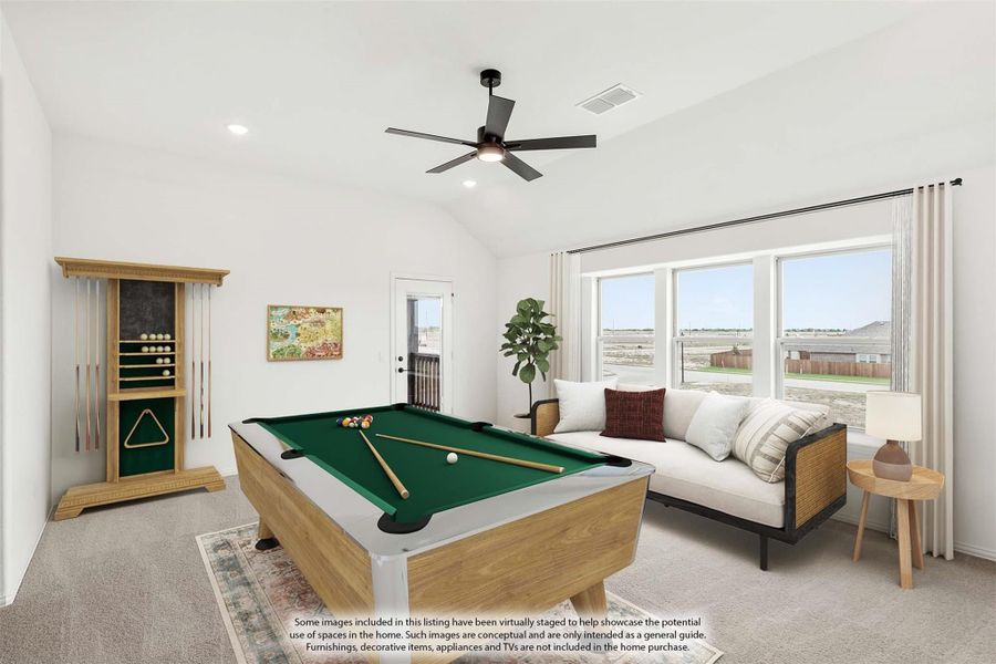 Game room with pool table, cue rack, sofa, ceiling fan, and large windows with vaulted ceiling Game room with pool table, cue rack, sofa, ceiling fan, and large windows with vaulted ceiling