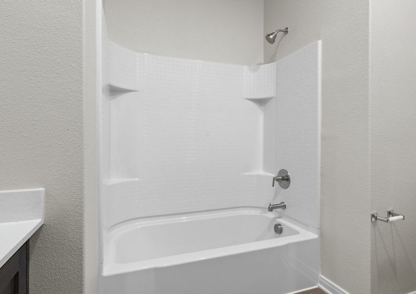 The secondary bathroom has a shower-tub combo.