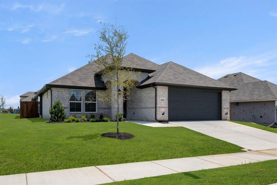 Front exterior of a new home in Summer Crest, Crowley, TX, highlighting curb appeal (Image 22).