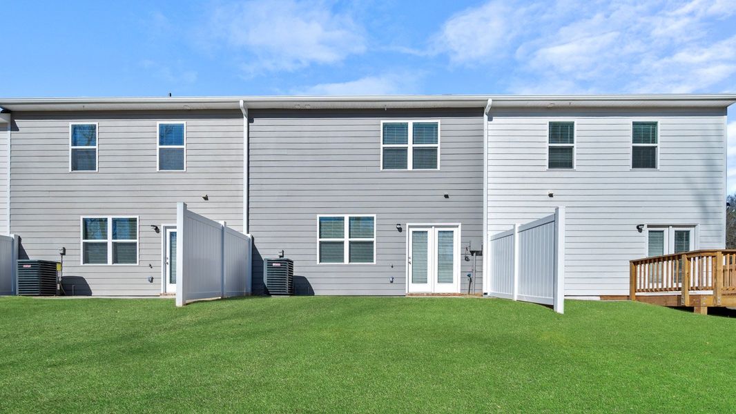 Exterior details and patio area of a home in Inverness at Sugarloaf, Lawrenceville (Image 3).