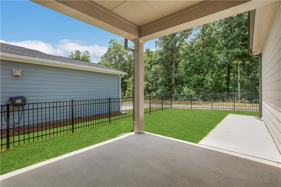 Exterior details and patio area of a home in Marble Tree, Ball Ground (Image 3).