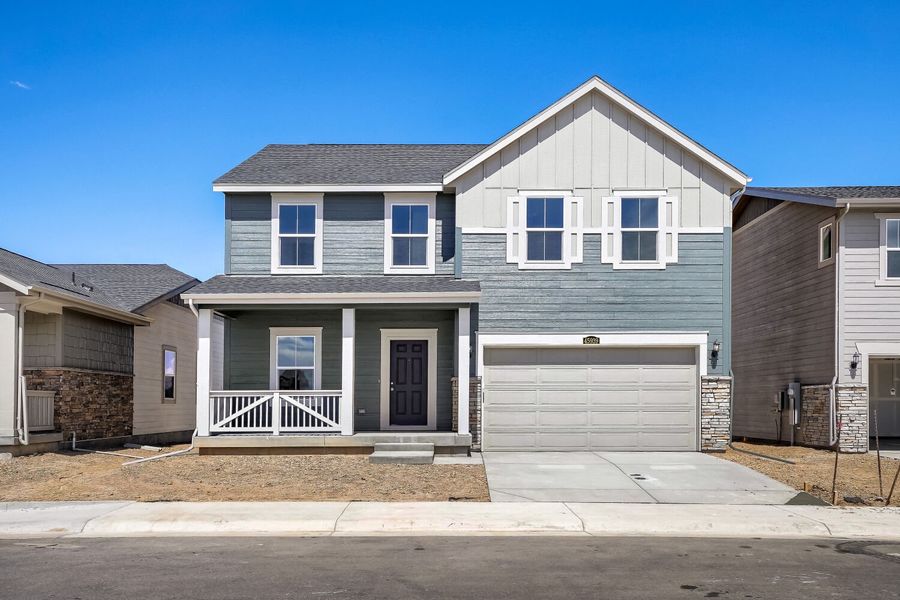 Front exterior of a new home in Muegge Farms, Bennett, CO, highlighting curb appeal (Image 1). Front exterior of a new home in Muegge Farms, Bennett, CO, highlighting curb appeal (Image 1).