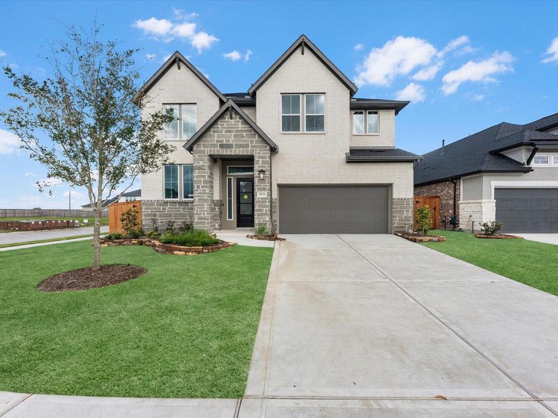 Front exterior of a new home in Trillium, Richmond, TX, highlighting curb appeal (Image 2). Front exterior of a new home in Trillium, Richmond, TX, highlighting curb appeal (Image 2).