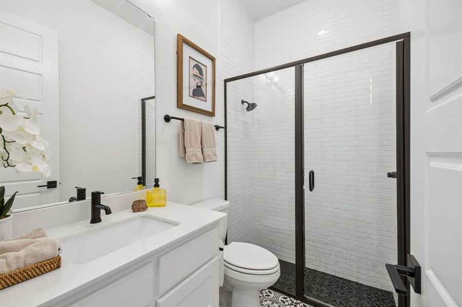 First floor's bathroom, right outside of downstairs bedroom. First floor's bathroom, right outside of downstairs bedroom.