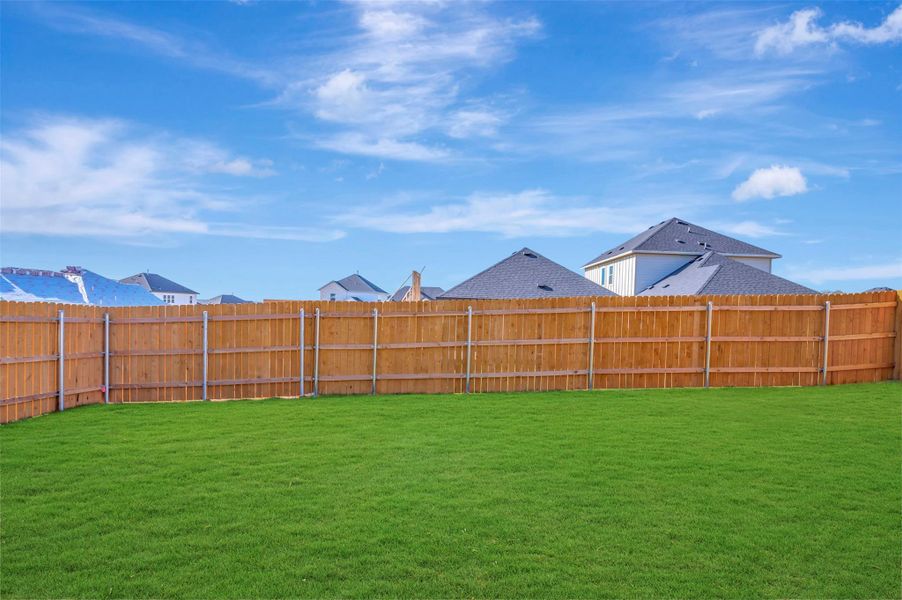 Exterior details and patio area of a home in Heritage, Dripping Springs (Image 21).