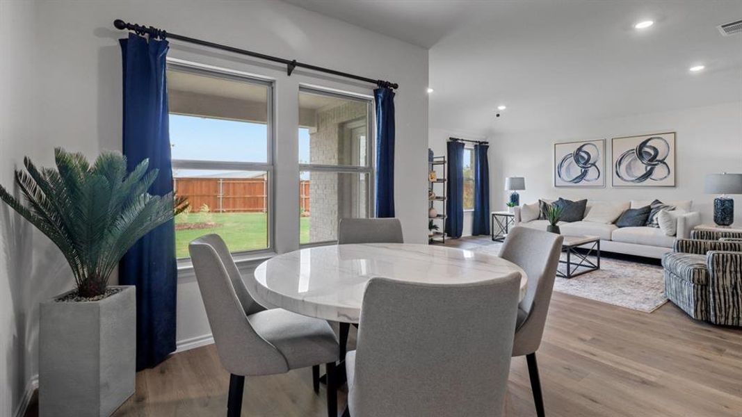 Dining area featuring light wood-style floors and recessed lighting Dining area featuring light wood-style floors and recessed lighting