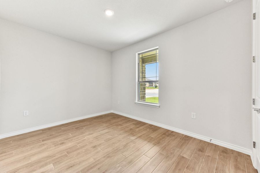 Spare room featuring light wood-style flooring and recessed lighting