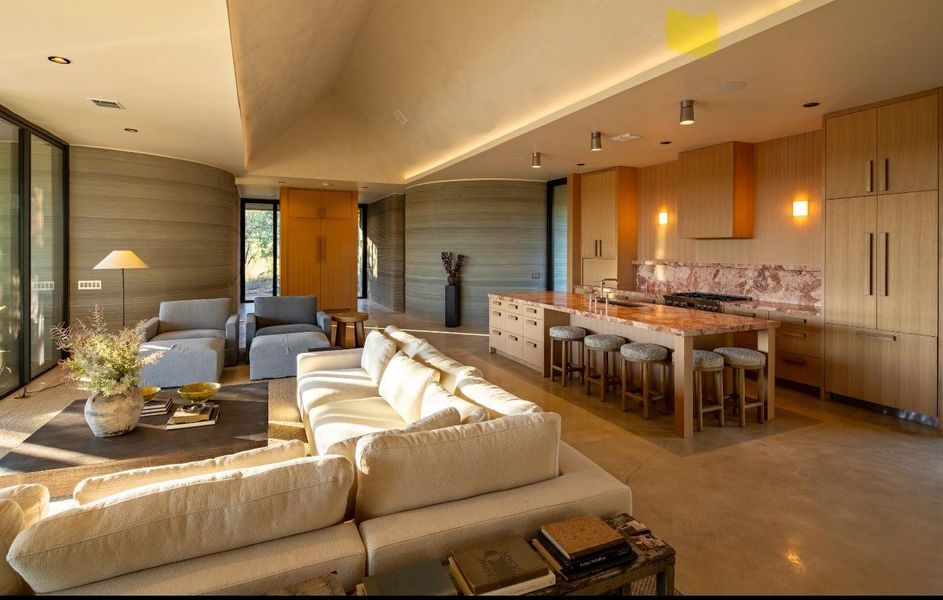 Living room featuring finished concrete floors and recessed lighting