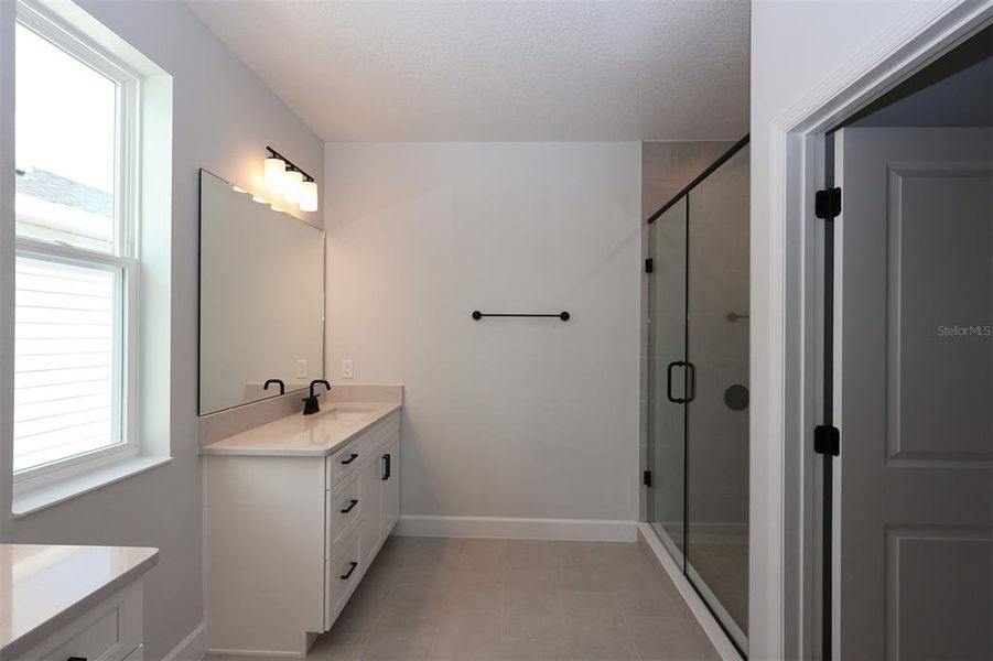 Furnished interior view inside a new home in Lake Star at Ovation, Winter Garden (Image 15).