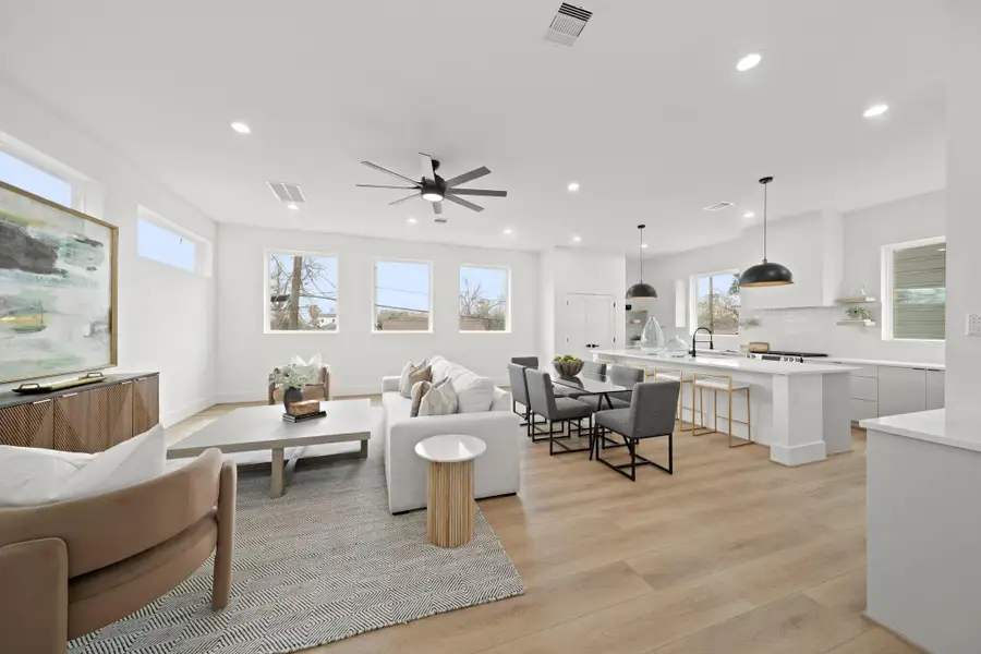Perfect for daily living and entertaining, this custom home features an open layout with an abundance of natural light that connects the kitchen, dining, family room and nearby half bath.