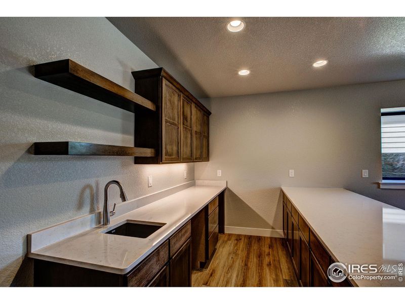 Open, spacious wet bar in basement