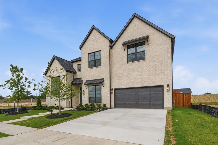 Front exterior of a new home in Custer Ridge Estates, Allen, TX, highlighting curb appeal (Image 29). Front exterior of a new home in Custer Ridge Estates, Allen, TX, highlighting curb appeal (Image 29).