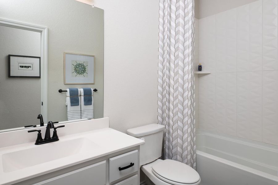 Bathroom 2 | Concept 2464 at Villages of Walnut Grove in Midlothian, TX by Landsea Homes