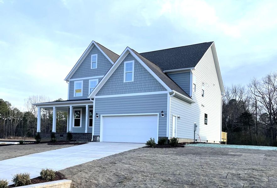 Front exterior of a new home in Hillcrest Grove, Wendell, NC, highlighting curb appeal (Image 2).