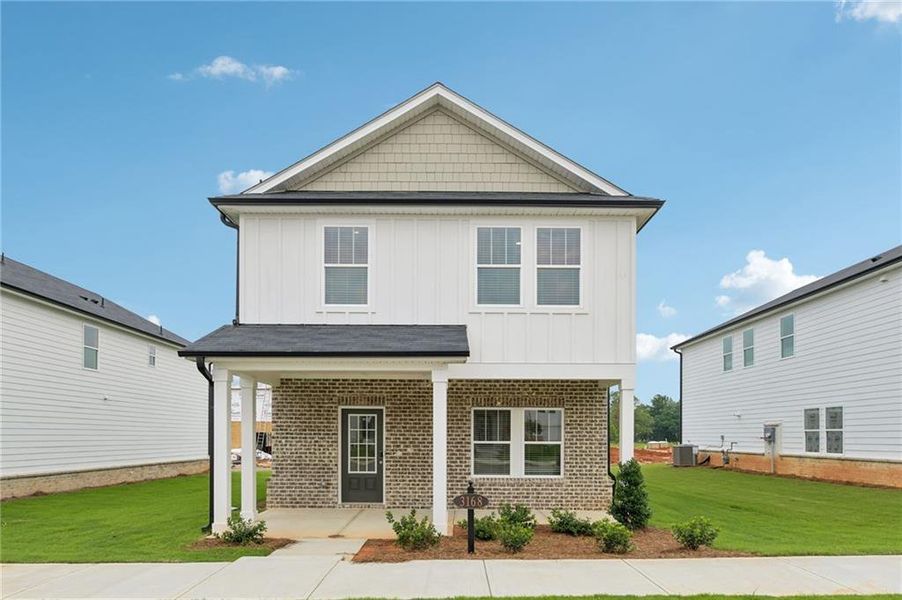 Front exterior of a new home in Martin Springs - Cottage Series, Lawrenceville, GA, highlighting curb appeal (Image 25).