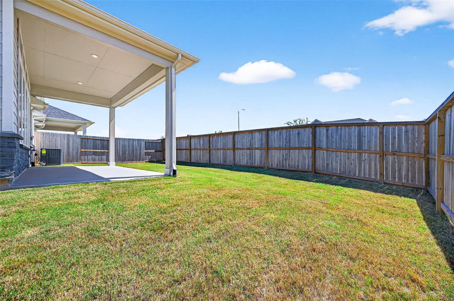 Exterior details and patio area of a home in Jordan Ranch: Signature Series, Katy (Image 25).