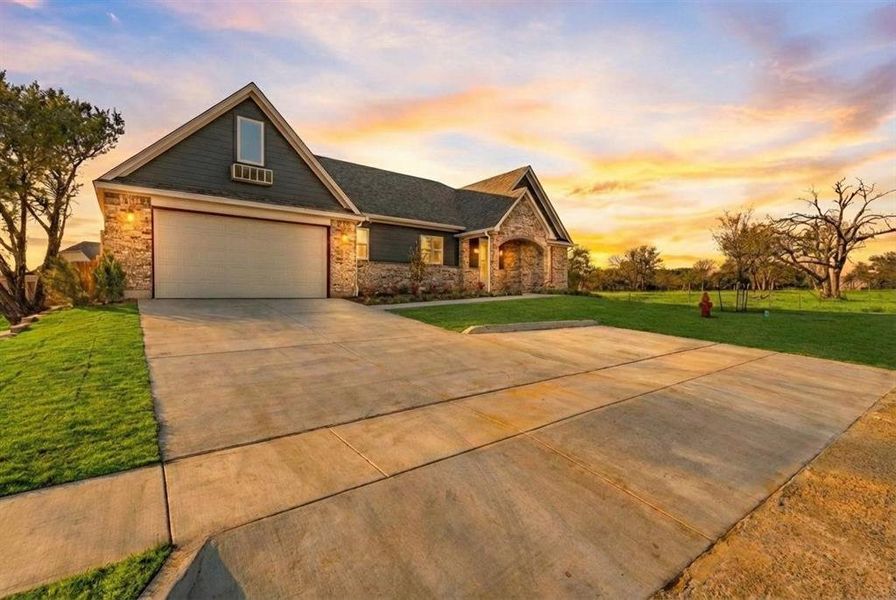 Front exterior of a new home in , Glen Rose, TX, highlighting curb appeal (Image 26).