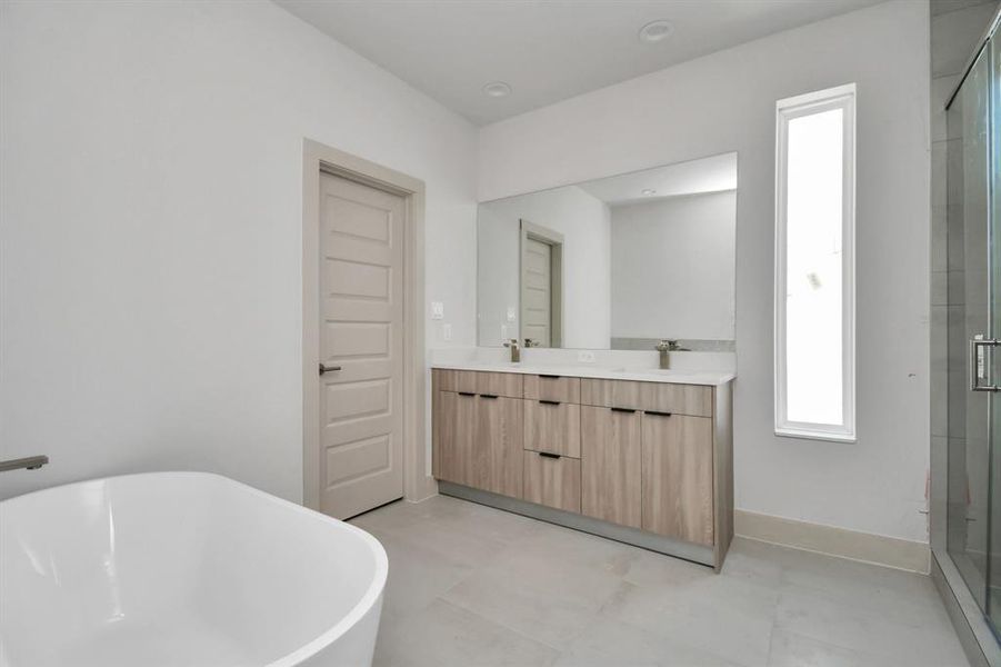 Primary Bedroom Bathroom with Spacious Walk-in Shower and Freestanding Tub